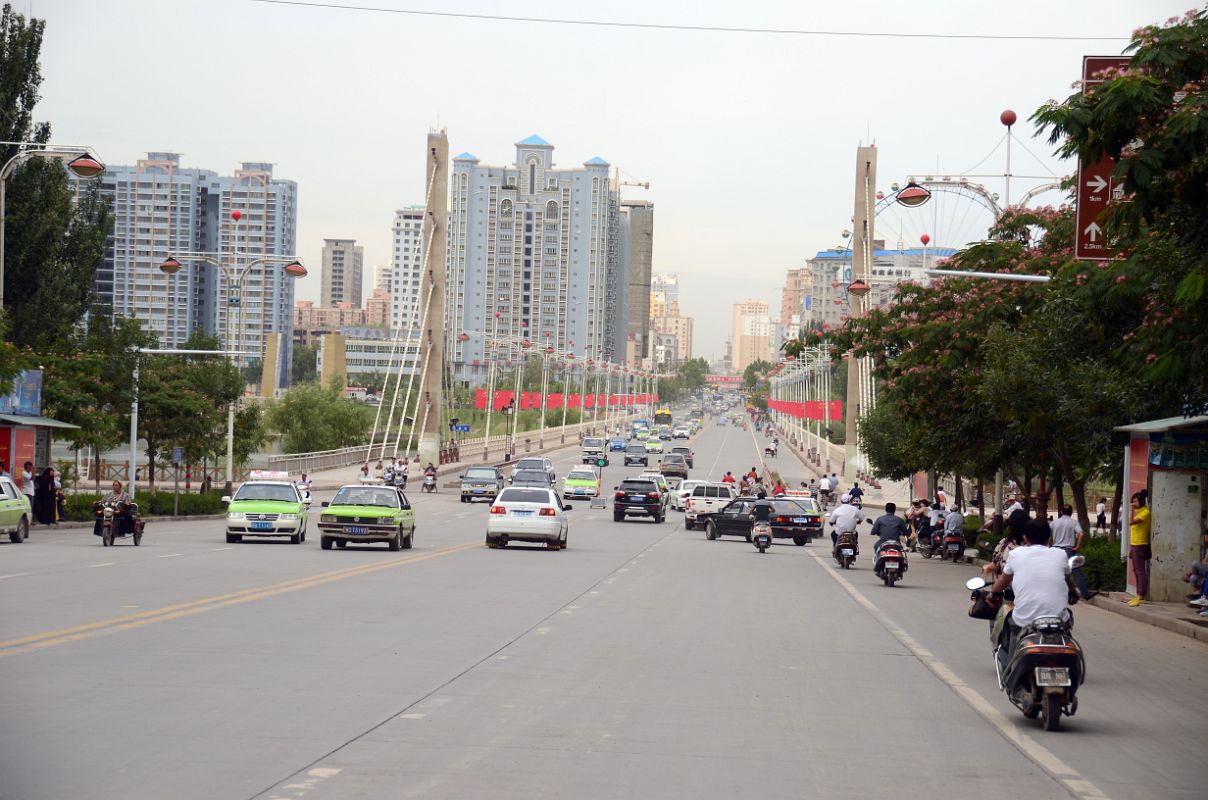 16 Kashgar Wide Street With Modern Buildings And Ferris Wheel